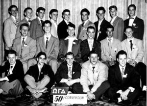 A group of men in suits and ties posing for a picture.